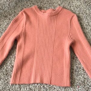 the shirt is very much of a. sweater like material and very comfy!